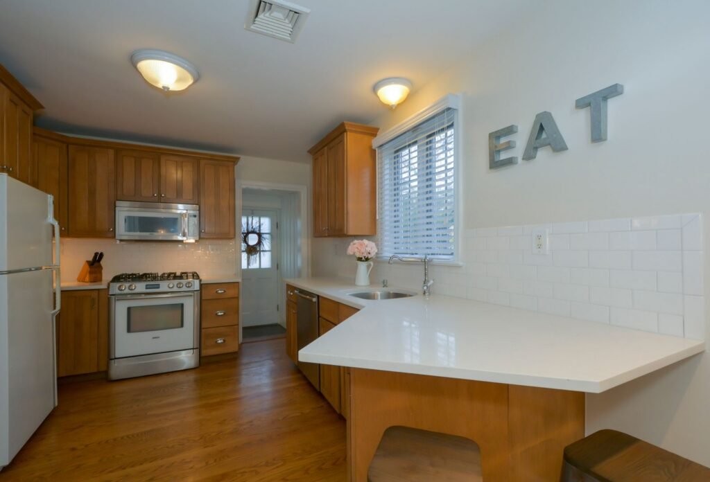 Illustrative photo: natural wood kitchen cabinetry and clean interior finishes
